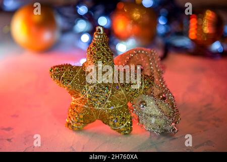 christmas decoration shiny ball and star on bokeh lights background Stock Photo