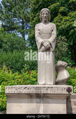 Montreal, Quebec, Canada, July 2012 - Statue of Jesus with hands folded and contemplative eyes in the garden of the St Joseph oratory Stock Photo