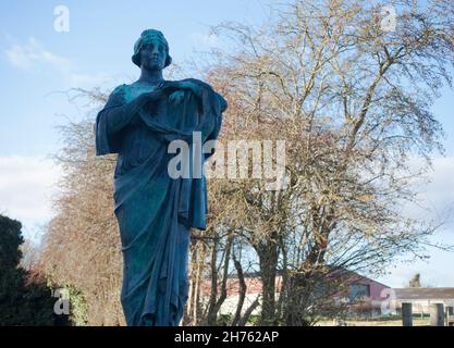 Warter Priory- Art nouveau statues monuments in rural churchyard Stock Photo