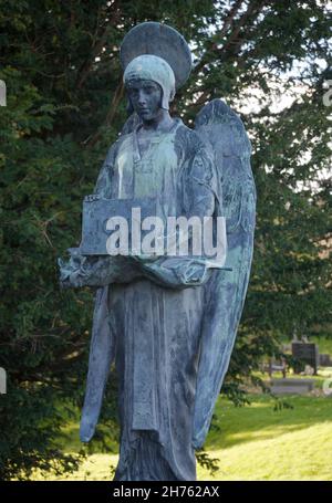 Warter Priory- Art nouveau statues monuments in rural churchyard Stock Photo