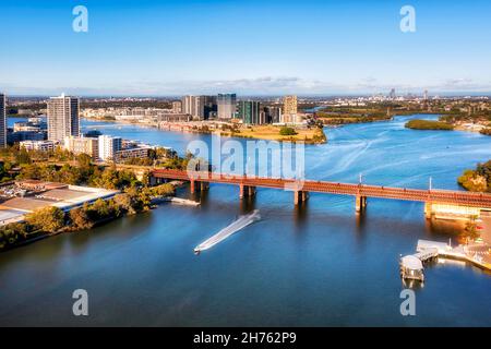John Whitton bridge on Parramatta river between Meadowbank and Wentworth point - aerial cityscape view. Stock Photo