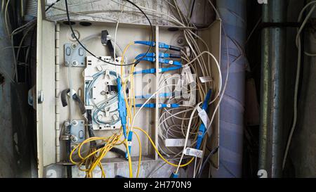 Electrical terminal in junction box open and broken with exposed wires, China Stock Photo