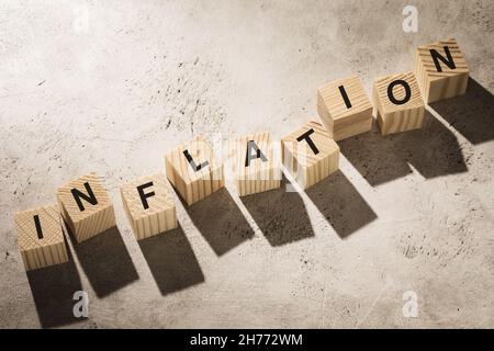 Wooden cubes with text on the table, concept on the topic of inflation Stock Photo