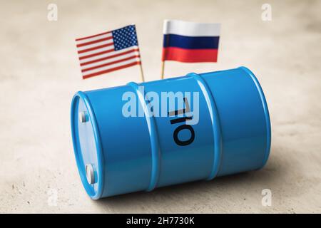 Oil barrel on the background of the flags of Russia and America, the concept on the topic of cooperation Stock Photo