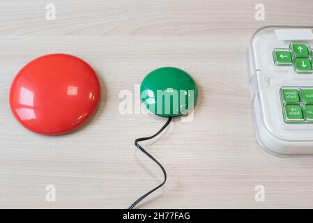Woman with cerebral palsy working on a specialized wireless computer mouse. Stock Photo