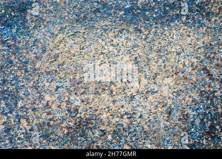 Granular stone texture in bluish and warm tones. Background Concept. Stock Photo