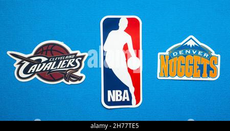 October 1, 2021, Springfield, USA, Emblems of the Denver Nuggets and Cleveland Cavaliers basketball teams on a blue background. Stock Photo