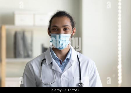 Head shot portrait African American man doctor wearing medical mask Stock Photo