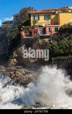 Waves splashing on the Cliff in the small village of Tellaro, in the Gulf of La Spezia, Liguria, Italy, Europe Stock Photo