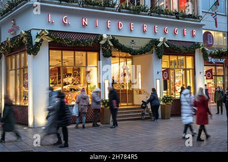 Lubeck, Germany, November 19, 2021: Entrance of the famous Niederegger marzipan store with Christmas decorations in the city of Luebeck, people in mot Stock Photo