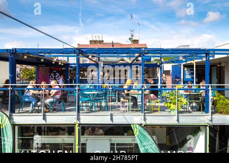 Interior of Buck Street Market made out of shipping containers, a new artisanal and food market in Camden, London, UK Stock Photo