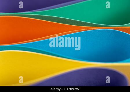 abstract horizontal photograph of folded bright multi colored paper with selective focus Stock Photo
