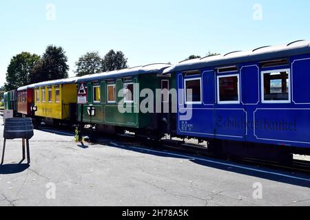 Stainz, Austria - September 23, 2021: Colorful wagons of the so-called Flascherlzug - bottle train - a narrow-gauge railway is a popular tourist attra Stock Photo
