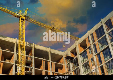 Panoramic top view several construction tower cranes of different heights at a building site during the construction Stock Photo