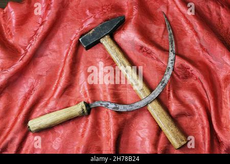 Sickle and hammer on rich red shawl Stock Photo