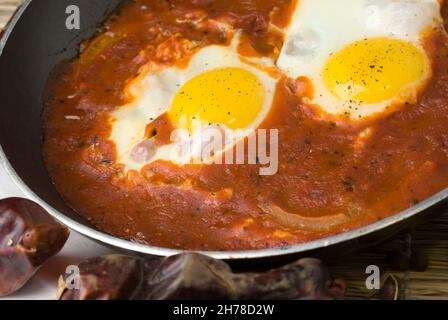 Shakshuka an Israeli dish made of cooked tomatoes, peppers, spices and eggs Stock Photo