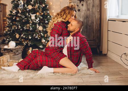 Young couple enjoying a romantic evening on Christmas eve Stock Photo