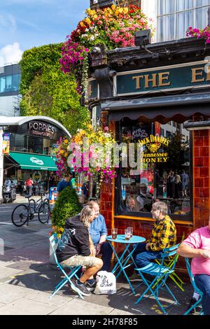 People drinking outside The Elephants Head pub on a sunny day, Camden High Street, Camden, London, UK Stock Photo