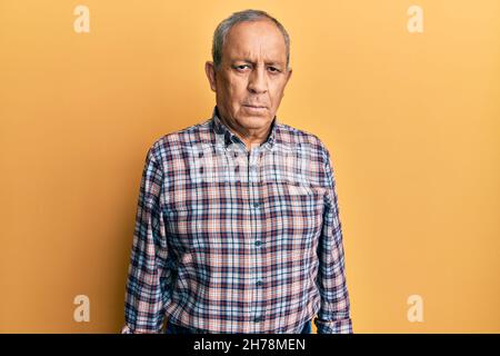 Handsome senior man with grey hair wearing casual shirt depressed and worry for distress, crying angry and afraid. sad expression. Stock Photo