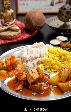 Indian Ethnical Food Thali wiith Vegetables and Chicken Curry with rice Stock Photo