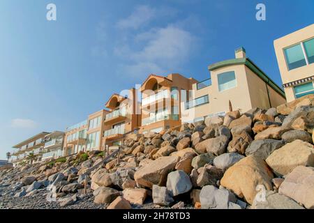 Beachfront accommodations with rocks at Oceanside, California Stock Photo