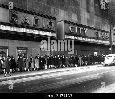 Queue / Line of Movie Patrons outside Radio City Music Hall New York Movie Theatre in February 1947 when showing SPENCER TRACY and KATHARINE HEPBURN in THE SEA OF GRASS 1947 director ELIA KAZAN novel Conrad Richter Metro Goldwyn Mayer Stock Photo