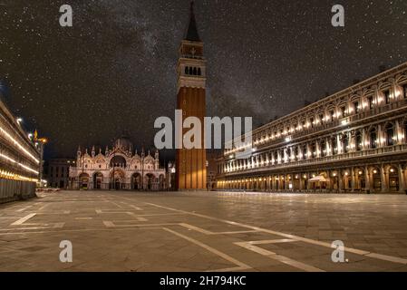 Empty St Marks Square and illuminated Basilica in the early Morning, Venice, Italy Stock Photo
