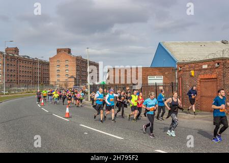 Wallasey, UK: Runners on Dock Road, during the Mersey Tunnel 10k, an event crossing from Liverpool to New Brighton via the Kingsway tunnel Stock Photo