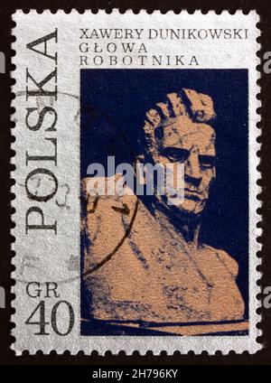 POLAND - CIRCA 1971: a stamp printed in the Poland shows Worker, Sculpture by Xawery Dunikowski, circa 1971 Stock Photo