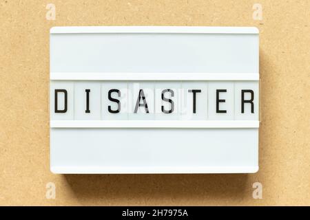 Lightbox with word disaster on wood background Stock Photo