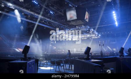 Strobe lights emitting different color beams hanging under the ceiling. Spotlight filler lights mounted on the ceiling. Stock Photo