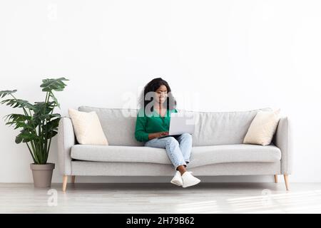 Stylish african american lady independent contractor working from home Stock Photo