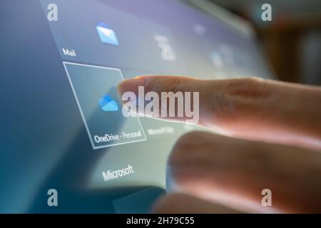 Bangkok, Thailand - November 20, 2021 : Computer user touching on Microsoft OneDrive, a file hosting service developed by Microsoft. Stock Photo