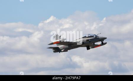 Rivolto del Friuli, Udine, Italy SEPTEMBER, 17, 2021 Grey light attack jet aircraft retracting the landing gear immediately after take off. Aermacchi MB-339 of Italian Air Force Stock Photo