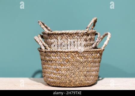 Close-up of wicker baskets on a blue background. Stock Photo