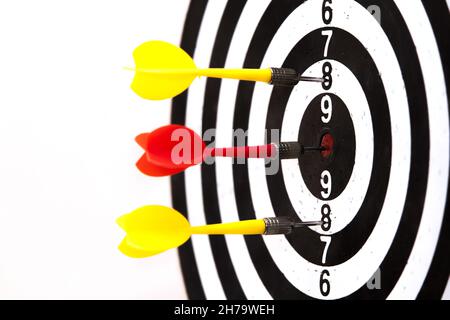 A dartboard with dart arrows hitting it - marketing and targeting concept Stock Photo