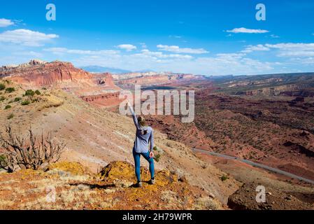 A cheerful young woman in the Capitol Reef National Park in Utah, the USA Stock Photo