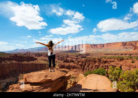 A cheerful young woman in the Capitol Reef National Park in Utah, the USA Stock Photo