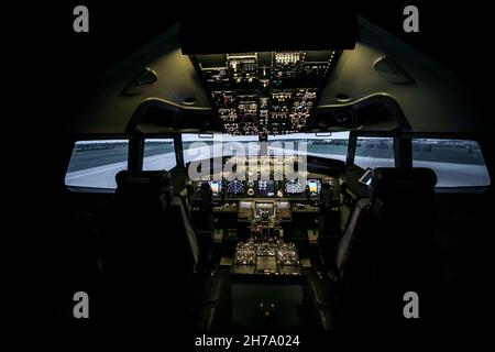 Aircraft interior, cockpit view inside the airliner. Point of view from a pilot place in a plane. Stock Photo