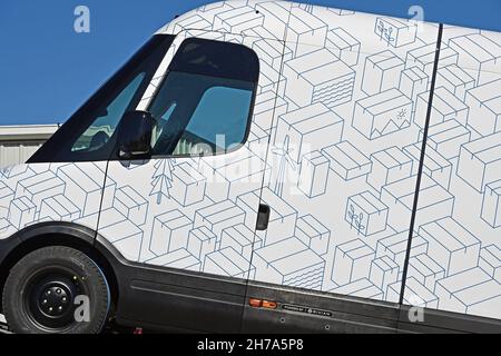 EMPORIA, KS, November 21: Two brand new model EDV 500 Rivian Electric Delivery Vans (EDV) part of the fleet order for Amazon on the back of a transportation lowboy truck parked in the Knights Inn Motel while traveling from the production plant in Normal Illinois to their final destination on November 21, 2021 in Emporia, Kansas. Credit: Mark Reinstein/MediaPunch Stock Photo