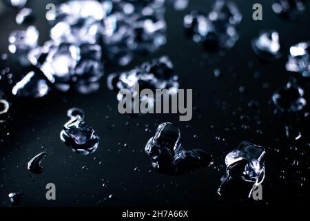 pile of different ice cubes on reflection table on black background  Stock Photo