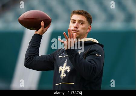 New Orleans Saints quarterback Ian Book (16) is slow to get up aft he was  sacked by Houston Texans defensive tackle Thomas Booker IV (56) during the  second half of an NFL