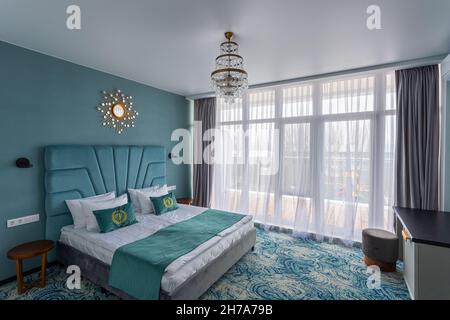 Bedroom in a hotel with a double bed Stock Photo