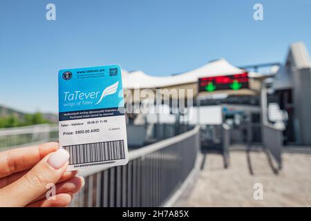 29 May 2021, Halidzor, Armenia: Ticket in hand to the Wings of Tatev cable car. Guinness World Records as the longest non-stop aerial tramway Stock Photo