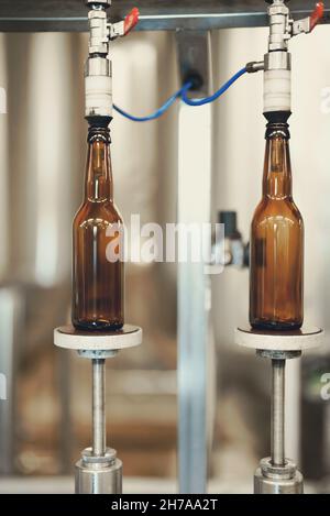 Empty bottles prepared for beer filling. Stock Photo