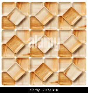 Many palm leaf plates texture isolated on a white background. Geometric tile pattern of empty square plates made of dry Areca palm leaf. Eco-friendly Stock Photo