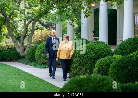 WASHINGTON DC, USA - 15 July 2021 - US President Joe Biden and German Chancellor Angela Merkel walk through the Rose Garden of the White House on Thur Stock Photo