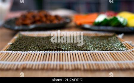 Premium Photo  Nori sushi roll in a bamboo mat