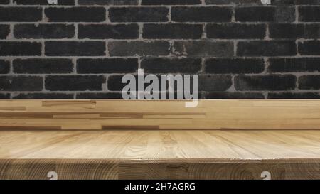 Vintage table on dark black brick wall background. Stock Photo