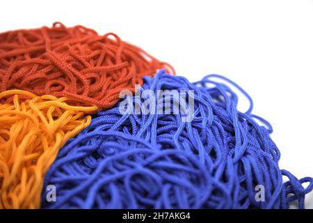 A closeup shot of multi-colored threads on a white background Stock Photo
